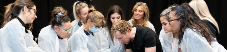 Dr. Sorr demonstrating an injection technique to Expo attendees